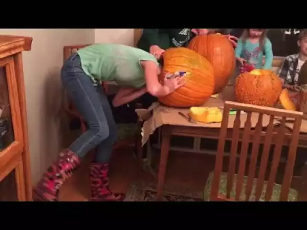Teenage girl gets her head stuck in massive pumpkin